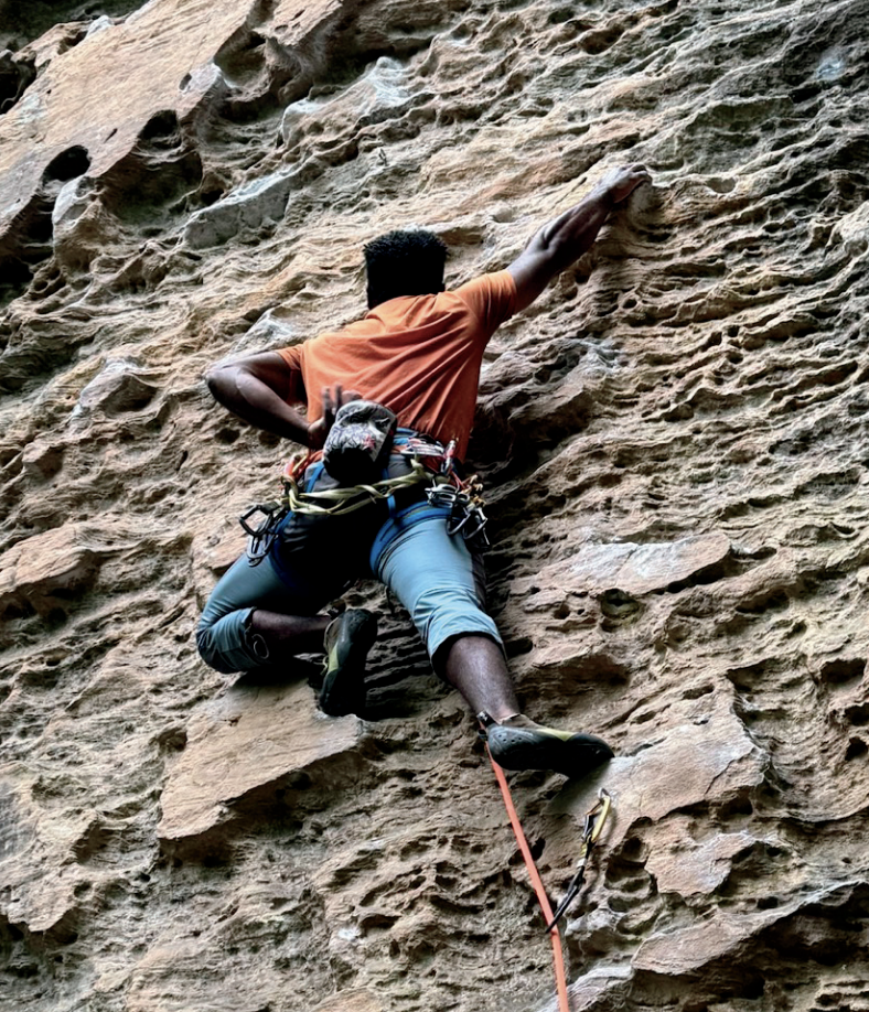 Difficult climb: Conestoga teacher Roheem Roten climbs at Red River Gorge in Winchester, Kentucky. He began rock climbing seven years ago after a co-worker suggested it for his health, and now coaches the sport two times a week.